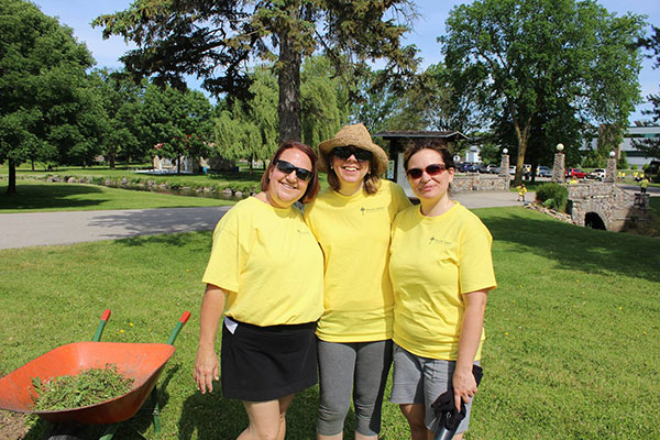 3 woman with yellow shirts on